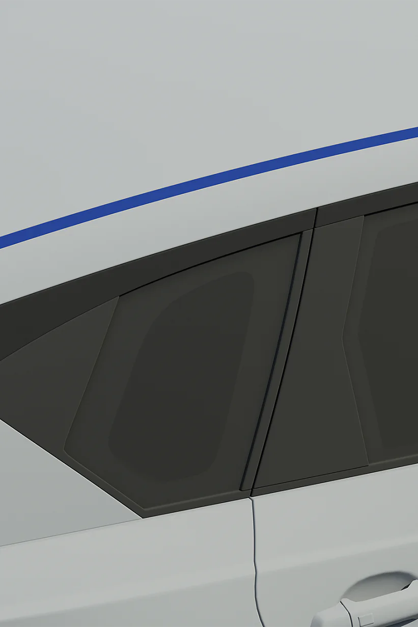 Close-up view of a silver cars rear section, showcasing the windows and roof. The roof has a blue stripe running along its length made with tesa tape. The rear door and a portion of the rear handle are visible. (This text has been generated by AI)