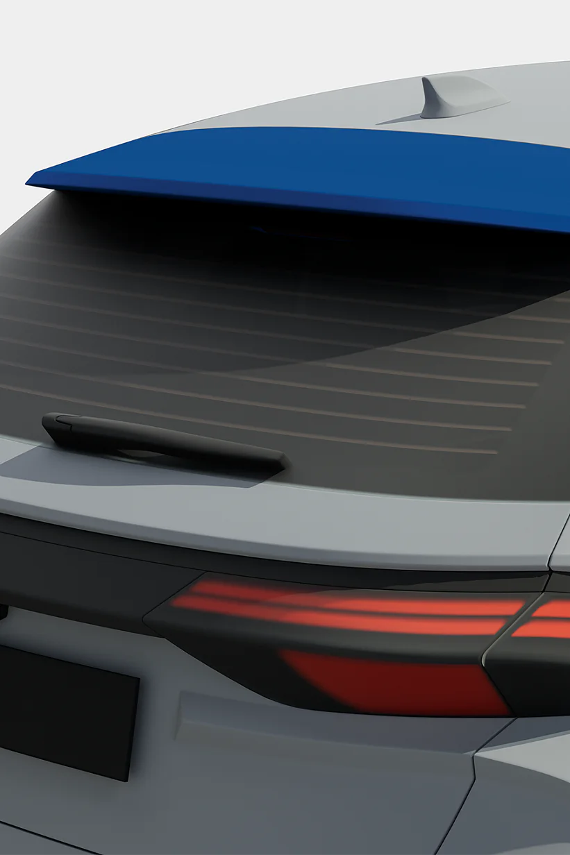 The image shows the rear view of a car with a blue spoiler. The car has tinted windows, sleek taillights, and a visible rear windshield wiper. tesa tape can be seen around the empty license plate area. The vehicle is mostly gray, with black trim detailing secured in place by tesa tape. (This text has been generated by AI)